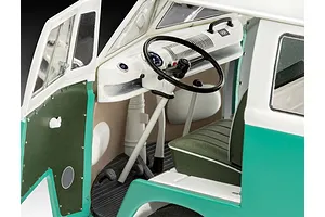 Close-up interior view of a 1/24 scale Revell VW T1 Bus model showing the dashboard, steering wheel, and front seat.