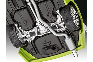 Underside view of a 1/25 scale model car showing the chassis, exhaust system, and suspension details.