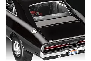 Rear view of a 1/25 scale black 1970 Dodge Charger model car showing the trunk, taillights, California license plate, and a NOS bottle inside.