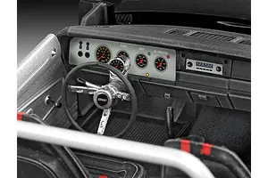 Close-up of the detailed interior dashboard and steering wheel of a 1/25 scale Revell 1970 Dodge Charger model kit.