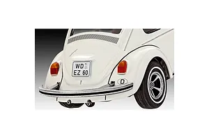 Rear view of a white Revell 1/32 scale Volkswagen Beetle model car showing the bumper, taillights, and German license plate.