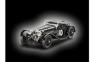A studio shot of a finished 1/32 scale black Jaguar SS 100 model car with number 10 on the side and a British flag decal on the hood.