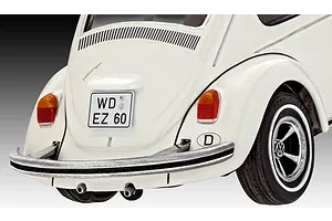 Close-up rear view of a white Revell 1/32 scale Volkswagen Beetle plastic model car, showing the bumper, taillights, and German license plate.