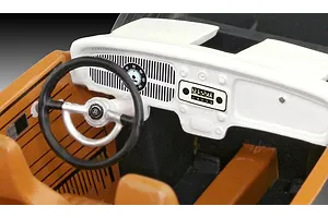 Close-up of the interior dashboard and steering wheel of a 1/32 scale VW Beetle model kit.