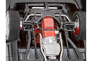 Underside view of a 1/24 scale model car showing the engine, transmission, and front suspension details.