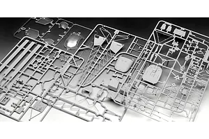 Grey plastic model kit sprues for a Revell 1/32 Alouette II helicopter, including clear canopy parts and various airframe components.