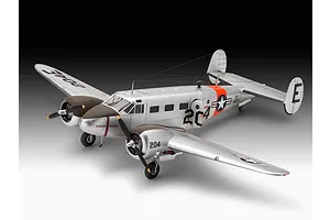 A completed 1/48 scale model of a silver Beechcraft Model 18 aircraft with US Navy markings, displayed against a gradient background.