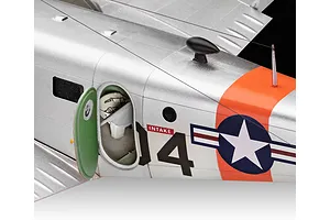 Close-up of a silver Beechcraft Model 18 plastic model aircraft showing the open cabin door, cockpit interior, and US military insignia.