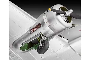 Close-up of a silver Beechcraft Model 18 scale model aircraft showing the engine cowling, propeller, and landing gear.
