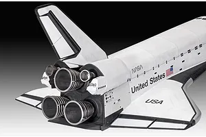 A close-up view of the rear section of a Revell 1/72 scale Space Shuttle model, showing the engine nozzles, vertical stabilizer, and NASA branding.