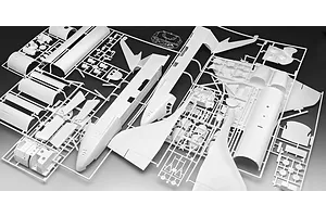 White plastic model kit sprues for a Space Shuttle model, showing various fuselage, wing, and engine components attached to frames.