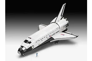 A completed 1/72 scale plastic model of the Space Shuttle Columbia, featuring NASA branding and a small scale figure standing in front for size comparison.