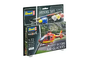 Revell 1/72 scale Airbus EC135 Air-Glaciers helicopter model starter kit in blister packaging with paints, glue, and brush.