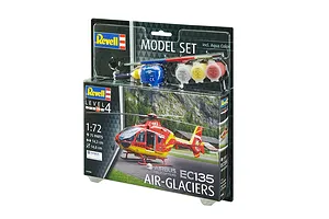 Revell 1/72 scale Airbus EC135 Air-Glaciers helicopter model starter kit in blister packaging with paints, glue, and brush.