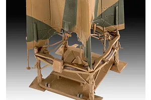 A close-up view of a 1/72 scale plastic model of a German A4-V2 rocket mounted on its launch platform, showing detailed camouflage and structural components.