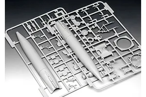 A grey plastic sprue containing parts for a 1/72 scale A4-V2 rocket model kit, including the rocket body and various support components.