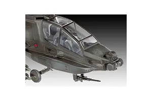 Close-up of the cockpit and nose section of a 1/100 scale AH-64A Apache helicopter plastic model kit, showing olive drab finish and clear canopy.
