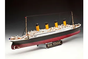 A fully assembled 1/400 scale plastic model of the RMS Titanic, featuring four yellow funnels, black and white hull, and a display stand with a nameplate.
