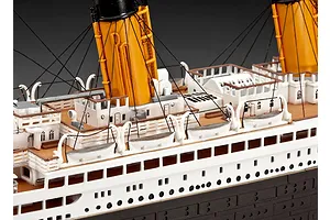 Close-up of a detailed Revell 1/400 scale RMS Titanic model showing the deck, lifeboats, and funnels.