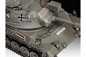 Close-up of a 1/35 scale plastic model of a Leopard 1 tank, featuring olive green paint, German military markings, and detailed turret and hull components.