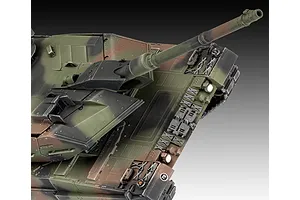 A high-angle close-up of a 1/35 scale Leopard 2 A6 model tank, showing the turret, main gun, and camouflage paint scheme against a grey background.