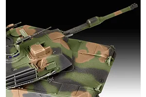 Close-up of a painted 1/72 scale M1 Abrams tank model showing the turret, main gun, and camouflage pattern.