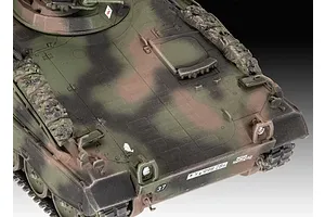 Close-up of the front hull and turret of a painted 1/72 scale Marder 1A3 model tank with camouflage paint.