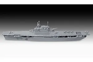 A side view of a grey, unpainted plastic model of the USS Enterprise aircraft carrier, showing the flight deck and island structure.