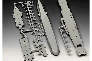 Grey plastic model kit sprues for a 1/1200 scale USS Enterprise aircraft carrier, including the hull, flight deck, and small aircraft components.