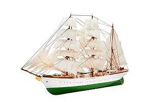 A fully assembled 1/350 scale plastic model of the Gorch Fock sailing ship with white sails and a green hull.
