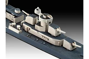 Close-up of a 1/700 scale plastic model warship deck showing gun turrets and superstructure details.