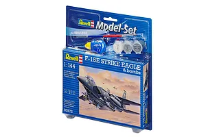 Revell 1/144 scale F-15E Strike Eagle model kit in blister packaging with included paint, glue, and brush.