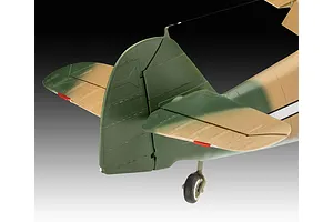 Close-up of the tail section of a Messerschmitt Bf 109 model aircraft, showing green and tan camouflage paint and a small tail wheel.