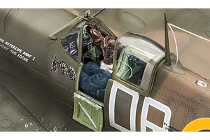 Close-up of a 1/32 scale Spitfire model cockpit featuring an Eddie pilot figure from Iron Maiden.