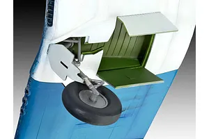 Close-up of the landing gear assembly on a painted plastic model of a Vought F4U-1A Corsair aircraft.