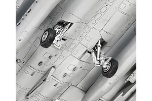 Close-up view of the underside of a plastic model Dassault Rafale C aircraft, showing landing gear detail and panel lines.