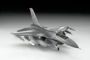 A 1/72 scale plastic model of an F-16 Fighting Falcon jet fighter, painted in grey with US Air Force markings, shown on a white background.