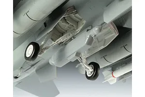 Close-up of the landing gear and under-wing fuel tanks of a 1/72 scale plastic model aircraft, showing detailed landing gear struts and wheels.