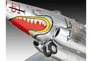 Close-up of a silver model aircraft nose with shark mouth nose art, landing gear, and warning decals.
