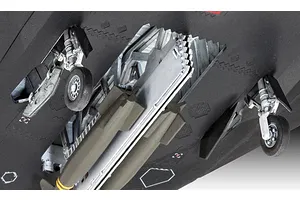 Close-up view of the underside of a plastic model F-117 Nighthawk showing landing gear and weapon bay details.
