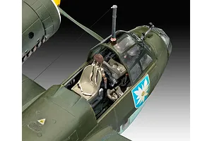 Close-up of the cockpit area of a 1/72 scale Junkers Ju88 A-1 plastic model aircraft, showing detailed interior seating and an edelweiss emblem on the side.