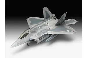 A fully assembled and painted 1/72 scale plastic model of a Lockheed Martin F-22A Raptor fighter jet, shown from a high-angle perspective.