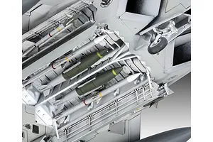 Close-up of the open weapons bay of a 1/72 scale F-22A Raptor model kit, showing detailed missiles and bombs mounted inside.