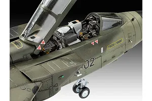 Close-up of a 1/72 scale Panavia Tornado plastic model aircraft cockpit and fuselage with open canopy and landing gear.