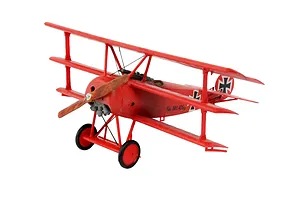 A fully assembled and painted red Fokker DR.1 triplane model aircraft on a white background.