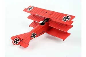 A fully assembled and painted red Fokker DR.1 triplane model aircraft on a white background.