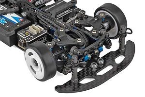 Close-up of the front chassis assembly of a Team Associated TC28 1/28 scale RC car, showing carbon fiber bumper, suspension, and electronics.