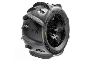 A single Pro-Line Dumont MT paddle tyre mounted on a black split-six RC wheel against a white background.