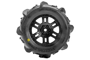 Pro-Line 1/16 Dumont MT paddle tyre mounted on a black split-six RC wheel, viewed from the side against a white background.