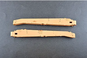 Two tan plastic model kit parts for the I Love Kit 1/16 M198 155mm Towed Howitzer, laid flat on a grey background.